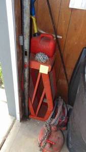 lot 141 image: Contents of Corner of Garage, Car Ramps, Gas Cans, Jumper Cables and Chain