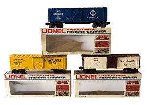 lot 40 image: Lionel O and 027 Gauge Milwaukee Road Box Car, Erie Lakawanna Box Car and D&RGW Cookie Box Car