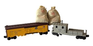 lot 89 image: Lionel Pacific Fruit Express Refrigerator Car, DL&W Caboose and Artificial Coal Bags