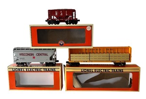 lot 97 image: Lionel Milwaukee Road I Beam Flatcar, Wisconsin Central Freight Car and M&STL Ore Car
