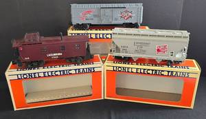 lot 232 image: Three Lionel Electric Train Cars including Lionel Model 6-16264 Red Wing Shoes Box Car