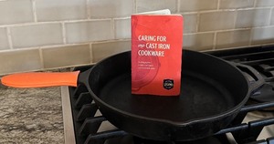 lot 57 image: Legend Cast Iron Skillet 12 Inch with Red Silicone Handle and Care Booklet