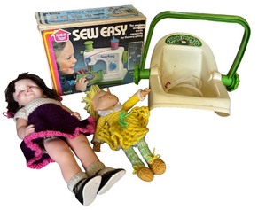 lot 46 image: Vintage Sew Easy Toy Sewing Machine, Cabbage Patch Kids Carrier, and Dolls Set