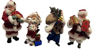 lot 72 image: Set of 4 Santa Claus Christmas Figurines with Gifts and Holiday Details