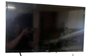 lot 30 image: TCL Roku TV Model 28S305 28-Inch LED Television