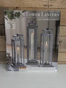 lot 40 image: Evergreen LED Tapered Candle All Steel Frame Tower Lantern - Silver - Pack of 3