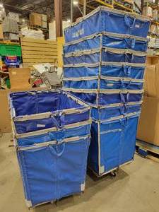 lot 14 image: Eleven Rolling Laundry Bins (584096)