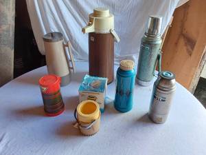 lot 62 image: Vintage Thermos and Coffee Servers including Stanley, Aladdin, and Thermos Brand