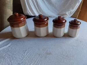 lot 63 image: Stoneware Canister Set with Brown Lids