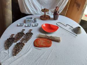 lot 67 image: Decorative Red Bowl, Booze Hound Bottle, ATC Super Deluxe lighter and Cast Iron Trivets