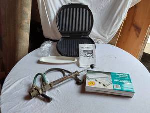lot 72 image: George Foreman Grill, Vacuum Sealer Rolls, and Tire Inflator