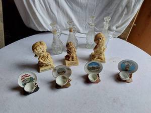 lot 87 image: Decorative Collectibles and Glassware including Figurines, Miniature Cup and Saucer Sets, and Decanters