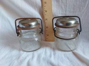 lot 155 image: Glass Salt and Pepper Shakers Marked 1893 FP on the Bottom