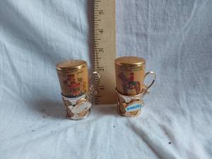 lot 235 image: Royal Canadian Mounted Police and Winnipeg Themed Salt and Pepper Shakers