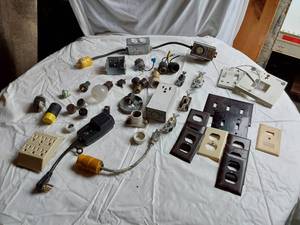 lot 275 image: Electrical Components Including Leviton Outlet Box, Light Sockets, and Switches