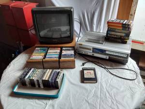lot 308 image: Braytonic TV, Sanyo VCR, and AudioVideo Media Collection including Cassettes and VHS Tapes