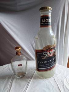 lot 335 image: Miller Genuine Draft Large Coin Bank and E&J Brandy Decanter