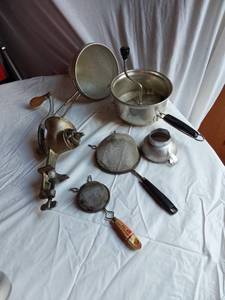lot 336 image: Foley Food Mill, Vintage Hand Crank Meat Grinder, and Assorted Kitchen Strainers