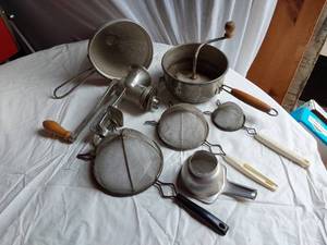 lot 337 image: Kitchen tools including Foley Food Mill, Keystone Grinder, and strainers
