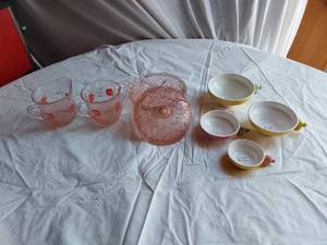 lot 360 image: Vintage kitchenware set including Menschik-Goldman measuring cups, pink Depression glass bowls, and floral glass mugs