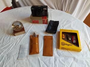 lot 415 image: Keltgen Promotional Items including AC35 Camera, Fishing Lures, and Knife Set