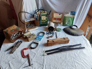 lot 427 image: Hi-Line Battery Charger Model 36-965 untested, Coping Saw Blades, and Hardware Assortment