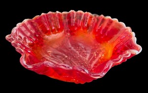 lot 67 image: Vintage Imperial Glass Red Satin Slag Ruffled Bowl with Grape Pattern