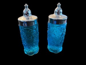 lot 95 image: Pair of Blue Daisy Button Pattern Glass Shakers with Silver-Tone Lids