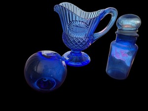 lot 99 image: Cobalt Blue Pressed Glass Pitcher, Apothecary Jar, and Art Glass Sphere Set