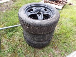 lot 99 image: Rim with Tires -Pile of 3