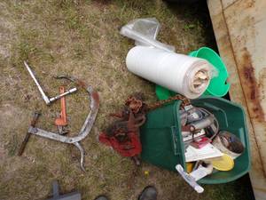 lot 135 image: Pipe vise, Green Tote with content, roll of Plastic, Green Bucket