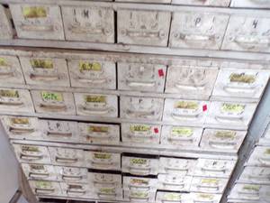 lot 254 image: By Wall 2nd Down- white medal bolt Bin with content -18 drawers