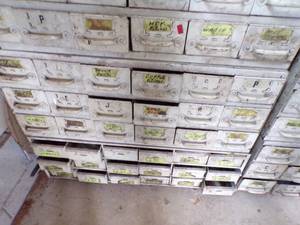 lot 255 image: By Wall 3rd Down- white medal bolt Bin with content -18 drawers