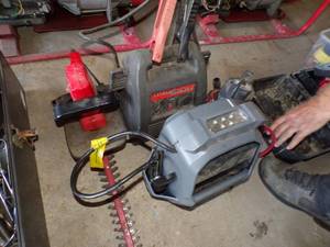 lot 395 image: 2- 12v Jumper Packs, hedge trimmer, pump