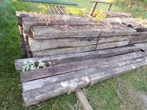 lot 504 image: Railroad Ties - 16 and 6 wooden Posts