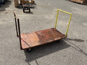 lot 76 image: Flat industrial metal dolly 60l x 30 w x 11t