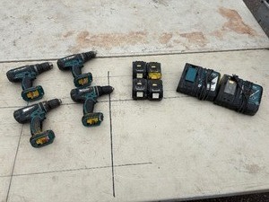 lot 217 image: (4) Makita rotary hammer drills BHP452, XPH01, LXPH01 Includes DC18RC chargers and 18V batteries