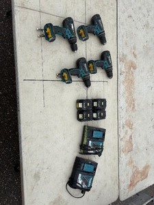 lot 218 image: (4) Makita rotary hammer  drills  three XPH01, one LXPH01. Includes DC18RC chargers and18V batteries