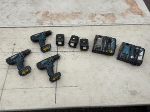 lot 219 image: (3) Makita rotary hammer driver drills  one XPH01, two LXPH01. Includes two chargers and four batteries.