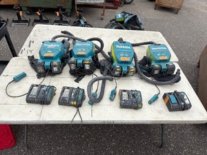 lot 235 image: (4) Makita Backpack XCV05 Vacuums HEPA filters  (4) DC18RC chargers and (8) batterie