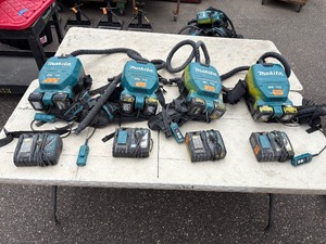 lot 236 image: (4) Makita Backpack XCV05 Vacuums HEPA filters  (4) DC18RC chargers and (8) batteries