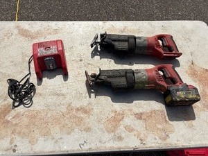 lot 269 image: (2) Milwaukee Cordless Sawzalls 0719-20 M28, (1) battery and (1) 48-59-2818 18V charger, all power up
