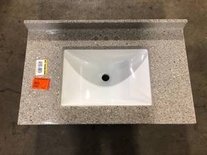 lot 16 image: Glacier Bay 37 in. W x 22 in. D Solid Surface White Round Single Sink Vanity Top in Caramel Customer Returns See Pictures