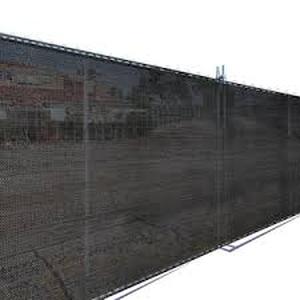 lot 56 image: 12 ft. x 50 ft. Black Privacy Fence Screen HDPE Fabric with Knitted Eyelets for Chain Link Garden Fence by Coolaroo Customer Returns See Pictures