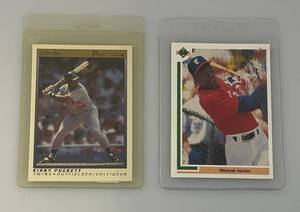 lot 6 image: 1991 Upper Deck #SPI Michael Jordon Card & O-Pee-Chee Kirby Pucket (Both In Protective Sleeves)