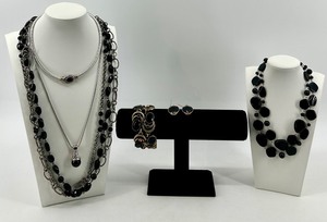 lot 28 image: Collection of Black and Silver Tone Fashion Jewelry Necklaces and Earrings