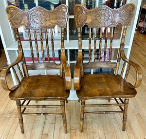 lot 2 image: Pair of Carved Oak Griffin Armchairs with Detailed Crest Backs