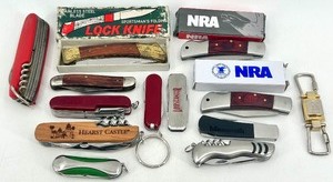lot 78 image: Collection of Pocket Knives and Keychain Accessories including NRA and Hearst Castle