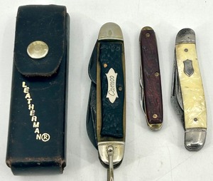 lot 79 image: Leatherman Multi-Tool with Sheath and 3 Vintage Pocket Knives