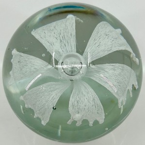 lot 100 image: Handcrafted Clear Glass Paperweight with White Flower Design